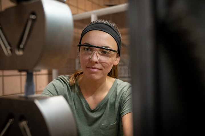 A student wearing safety goggles