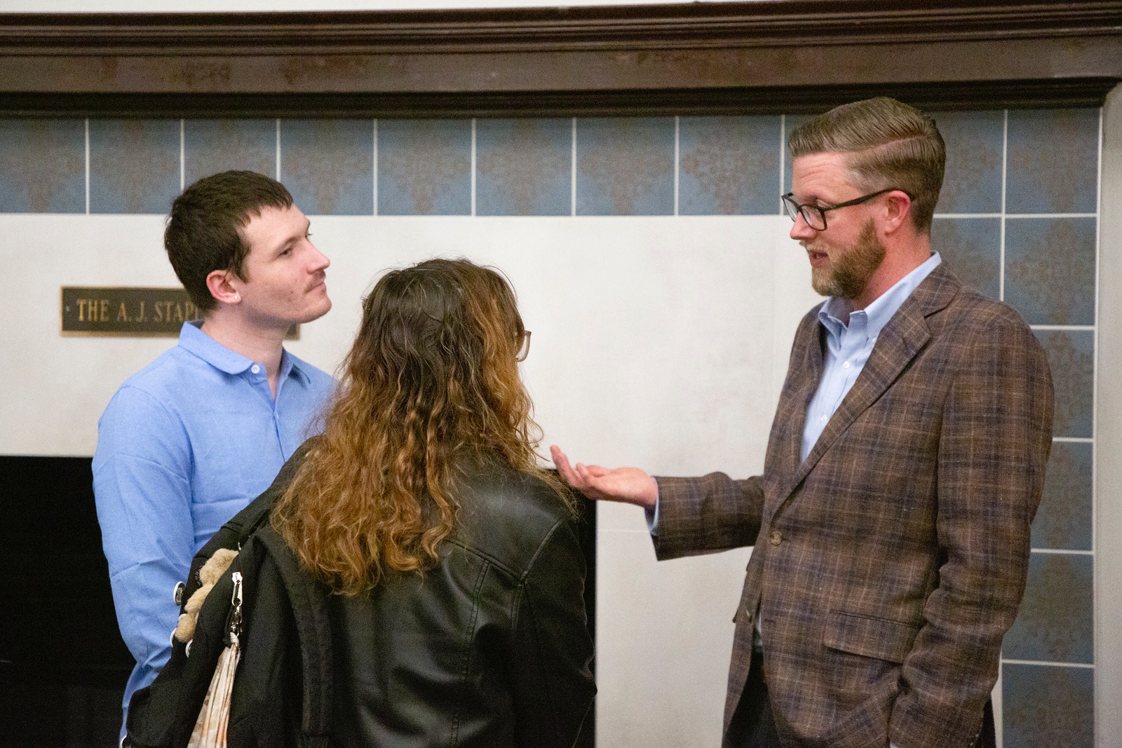 Students having conversation following lecture