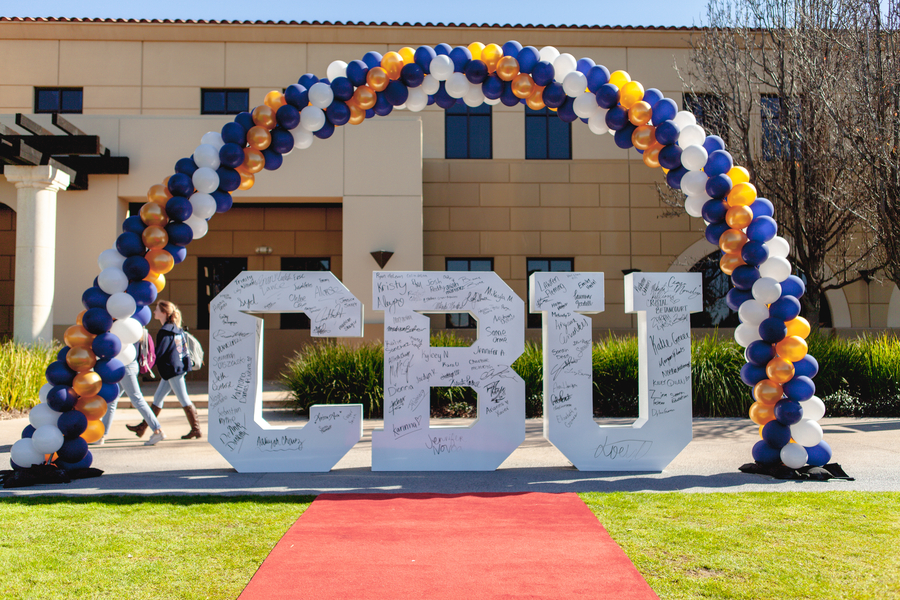 A palm tree lined path on the California Baptist University campus