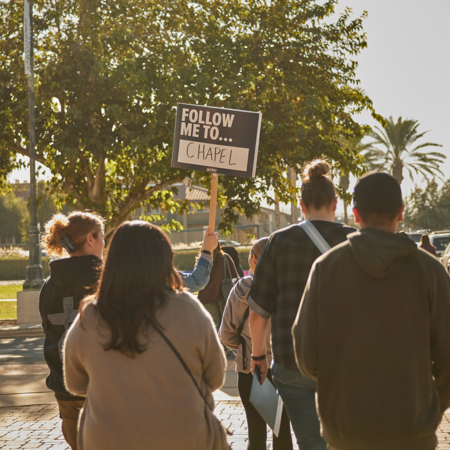 Prospective students following a guide