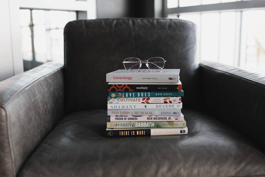 A stack of books resting on a chair