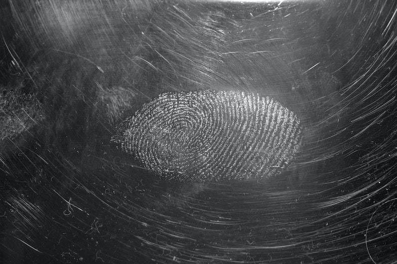 A fingerprint on a dark surface