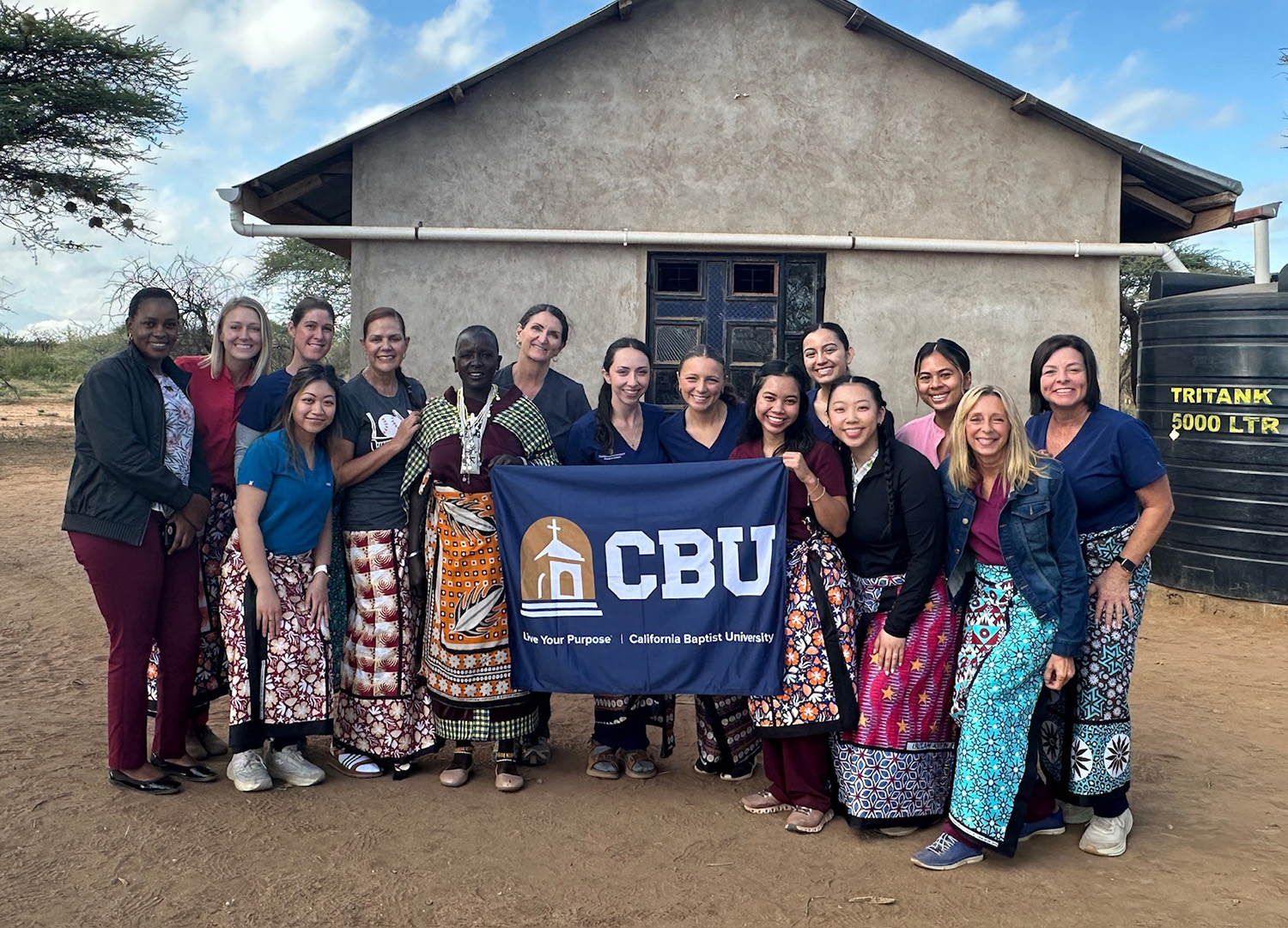 CBU Students and faculty holding up CBU flag