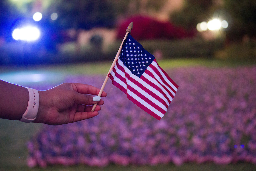 an american flag held by someone