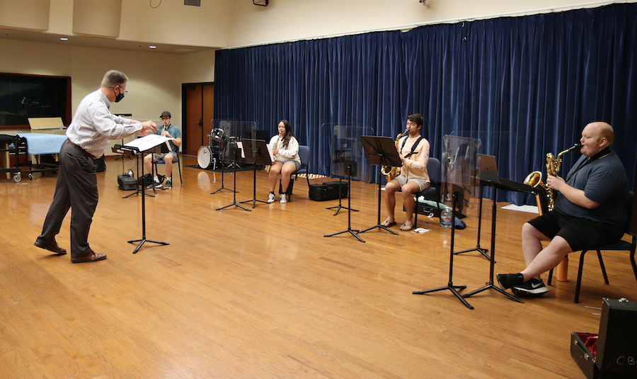 students practicing music with space between them