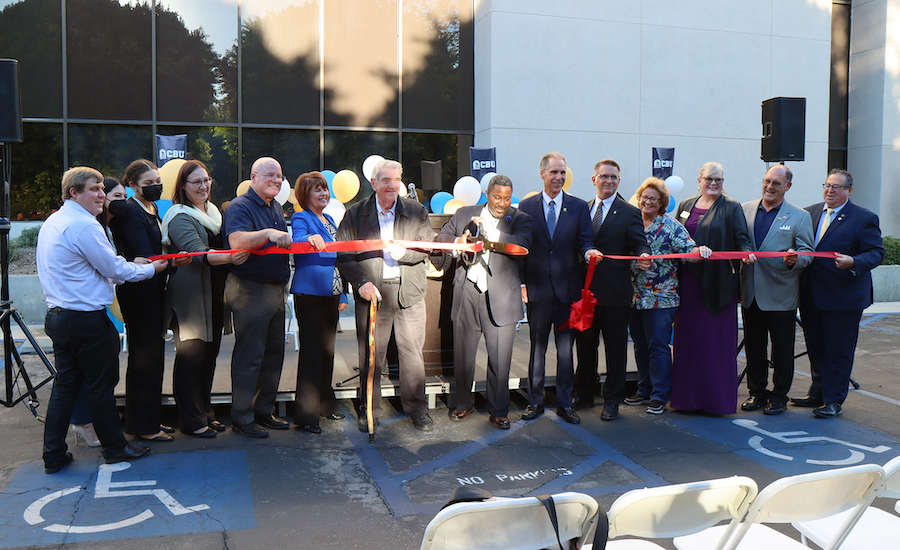 ribbon cutting in front of building