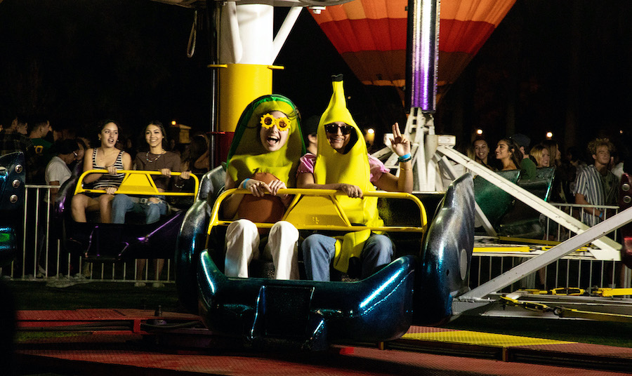 people riding a carnival ride