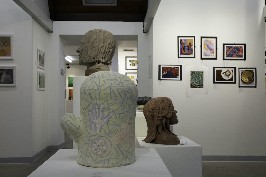 Artwork fill the walls and space of the Rose Garden Chapel Gallery for the annual Honors Exhibit. Comprised of more than 100 pieces of various media created by about 45 California Baptist University students, this event is the largest art event of the year.