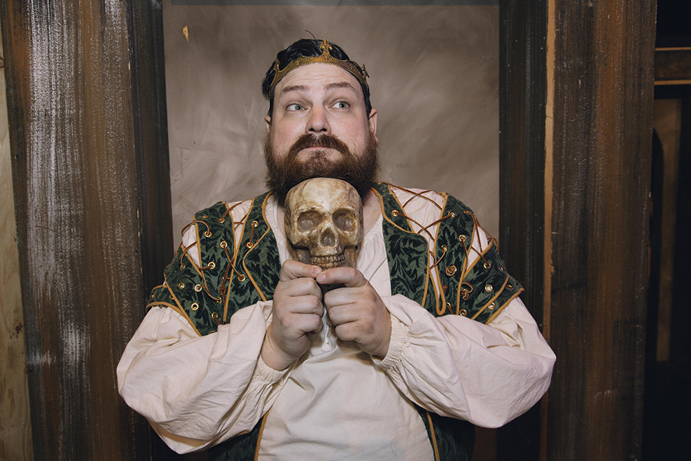 actor holding skull
