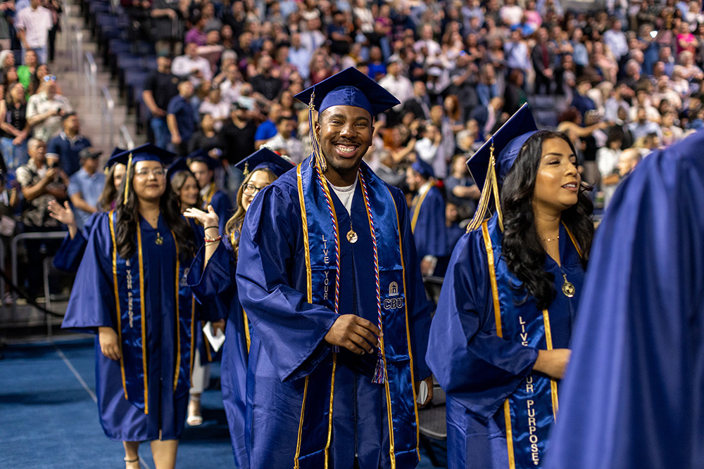 graduates walking in