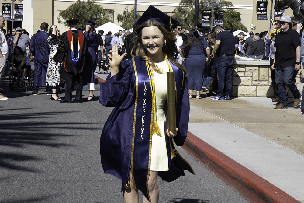 graduate smiling for the camera