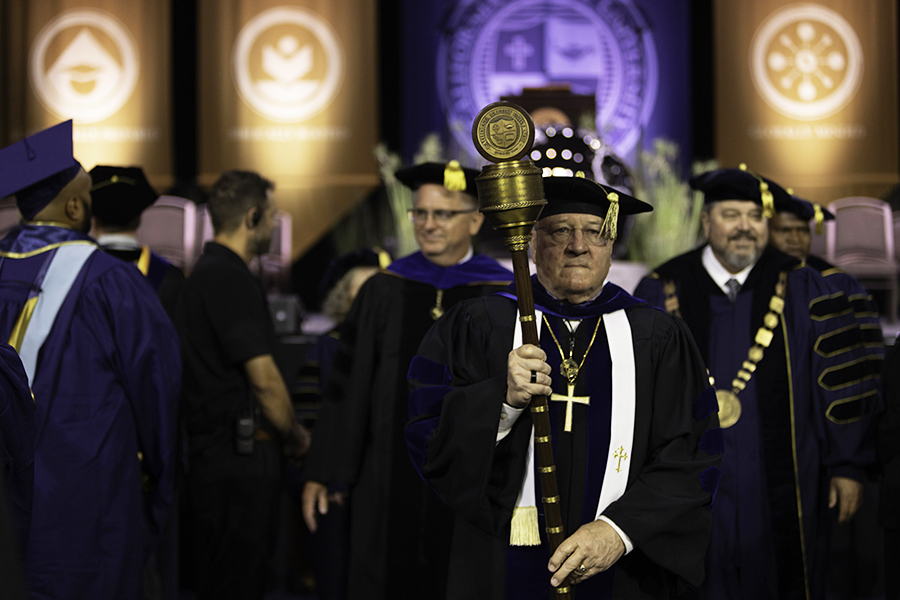 Dr. Bruce Stokes leading the procession