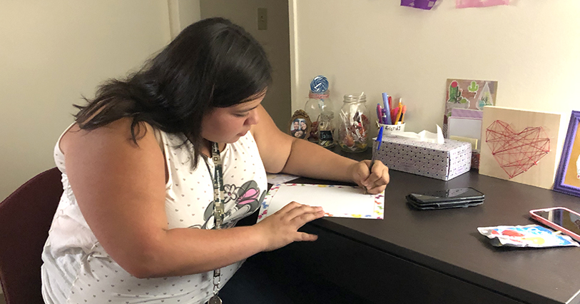 A group of California Baptist University students observed Breast Cancer Awareness Month by writing letters of encouragement for individuals battling breast cancer.