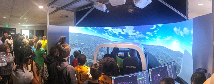 Riverside Mayor Rusty Bailey (center) along with Riverside community members visit the Aviation Science program at California Baptist University on June 8. 