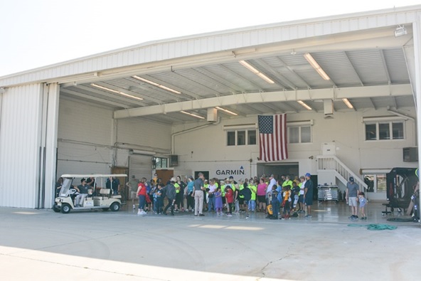Riverside Mayor Rusty Bailey (center) along with Riverside community members visit the Aviation Science program at California Baptist University on June 8. 