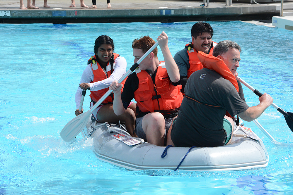 four in raft in pool