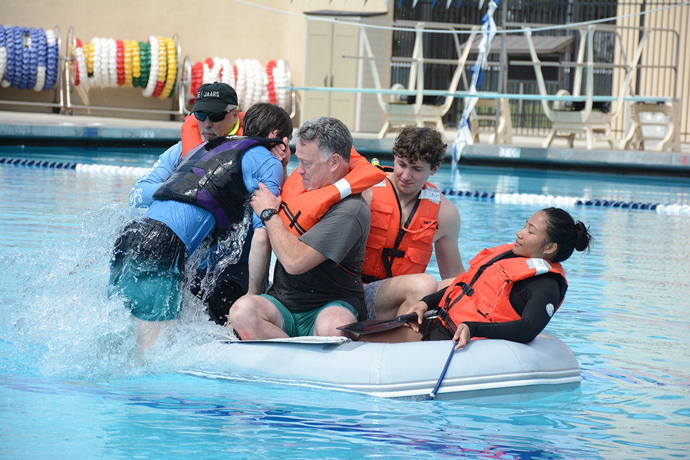 pulling man into raft