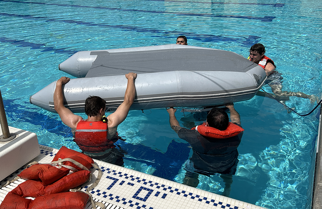 overturned raft in pool