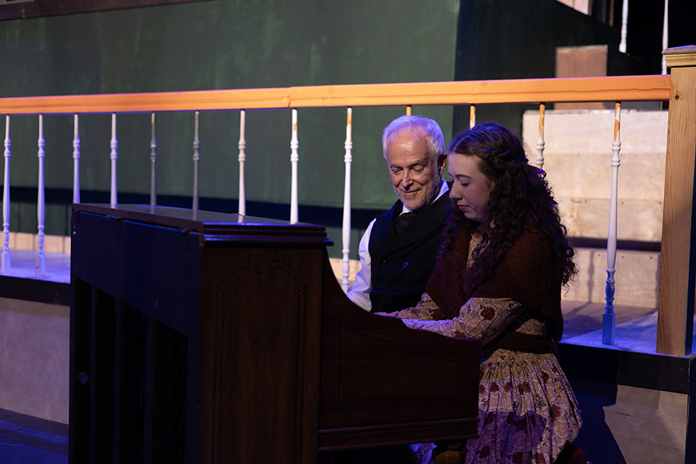 two actors at the piano