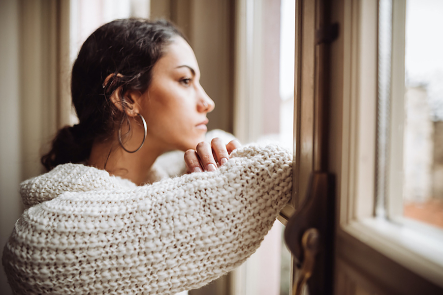 girl looking out of a window