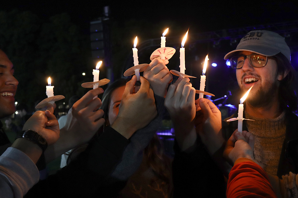 holding Christmas candles