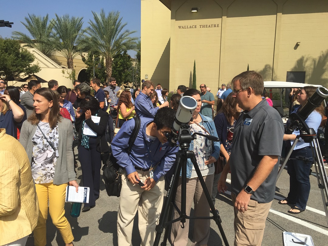 California Baptist University faculty and staff members use                       special eyeglasses and telescopes equipped with protective filters to view a                       solar eclipse described as the most observed in history. 