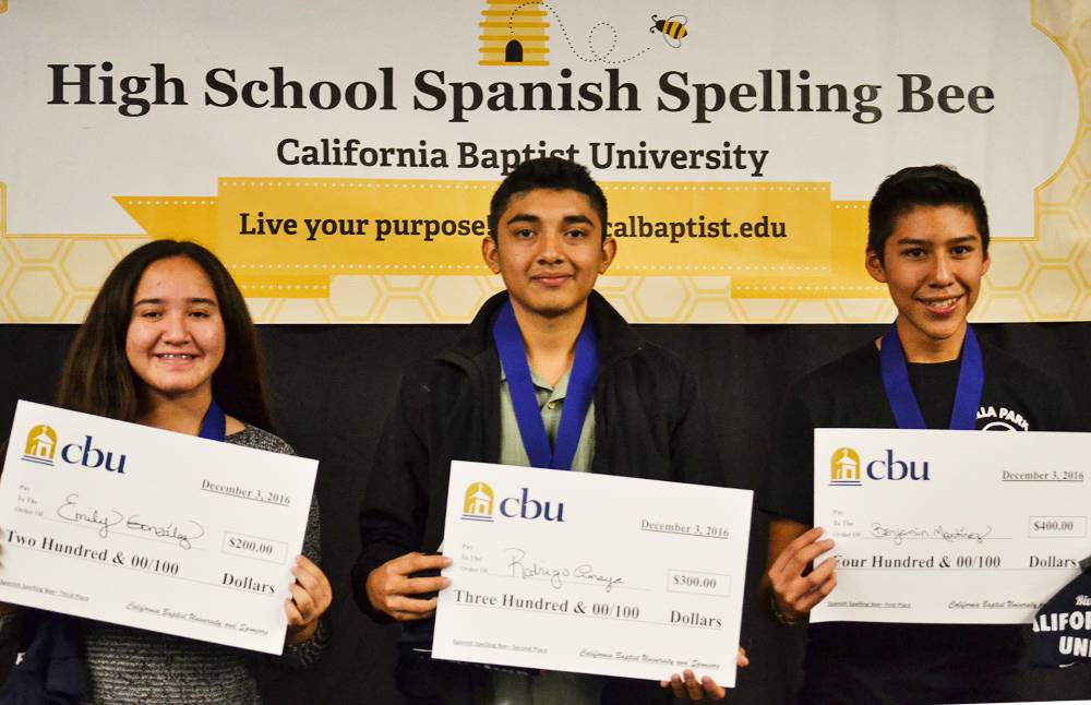 The top three finishers at the Spanish Spelling Bee at California                       Baptist University (from left) Emily Gonzalez, Rodrigo Amaya and Benjamin                       Martinez proudly display their event prizes. 