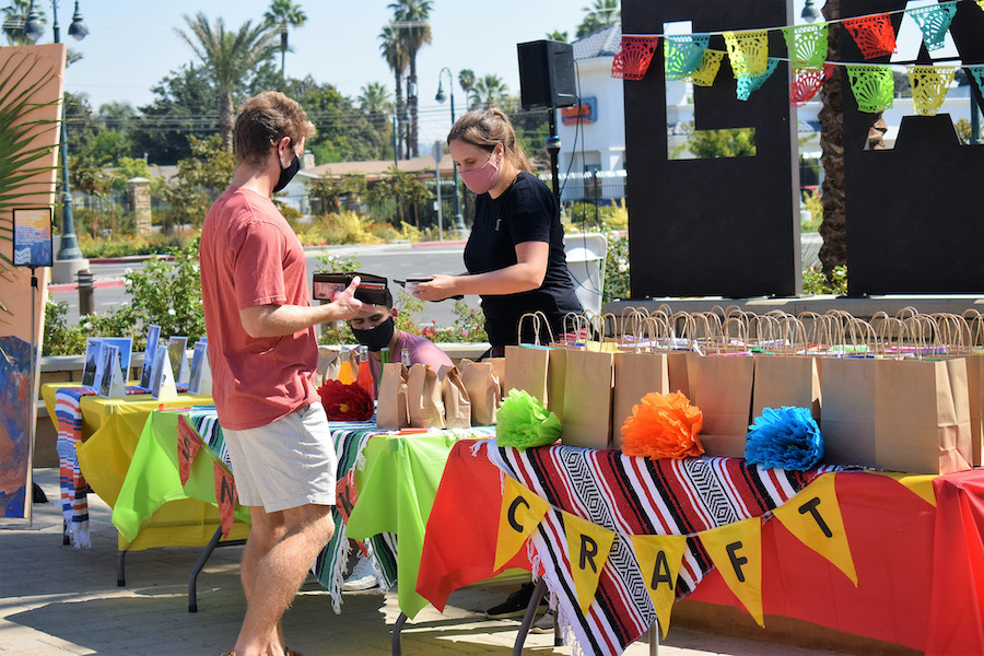 A mix of Latin music blasted from the speakers in Lancer Plaza as students at California Baptist University waited for their grab bag at Community Life's Hispanic Heritage Month celebration.