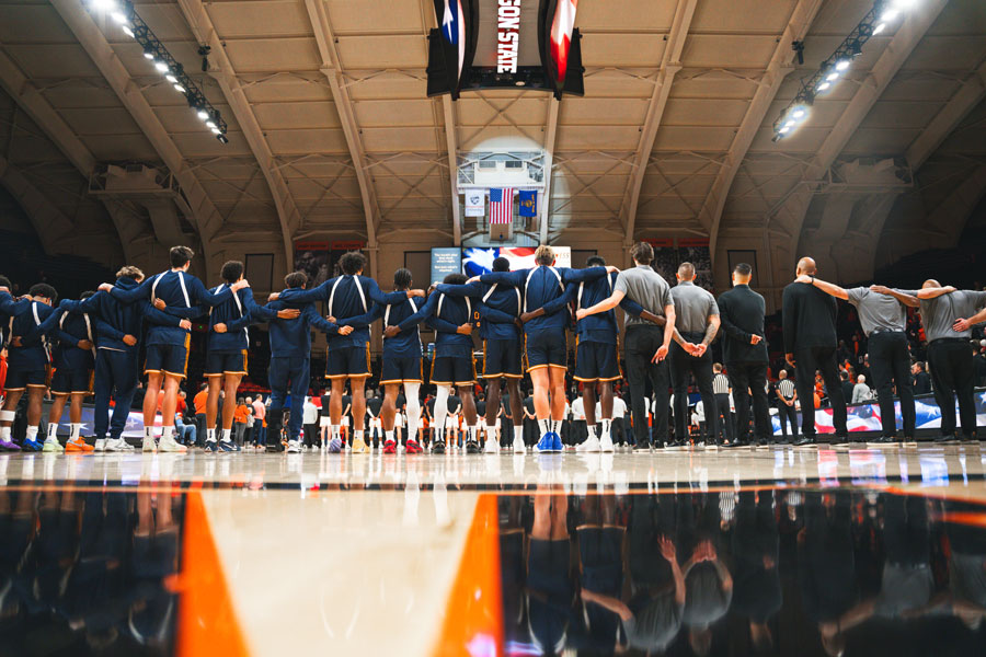 CBU Team praying on court