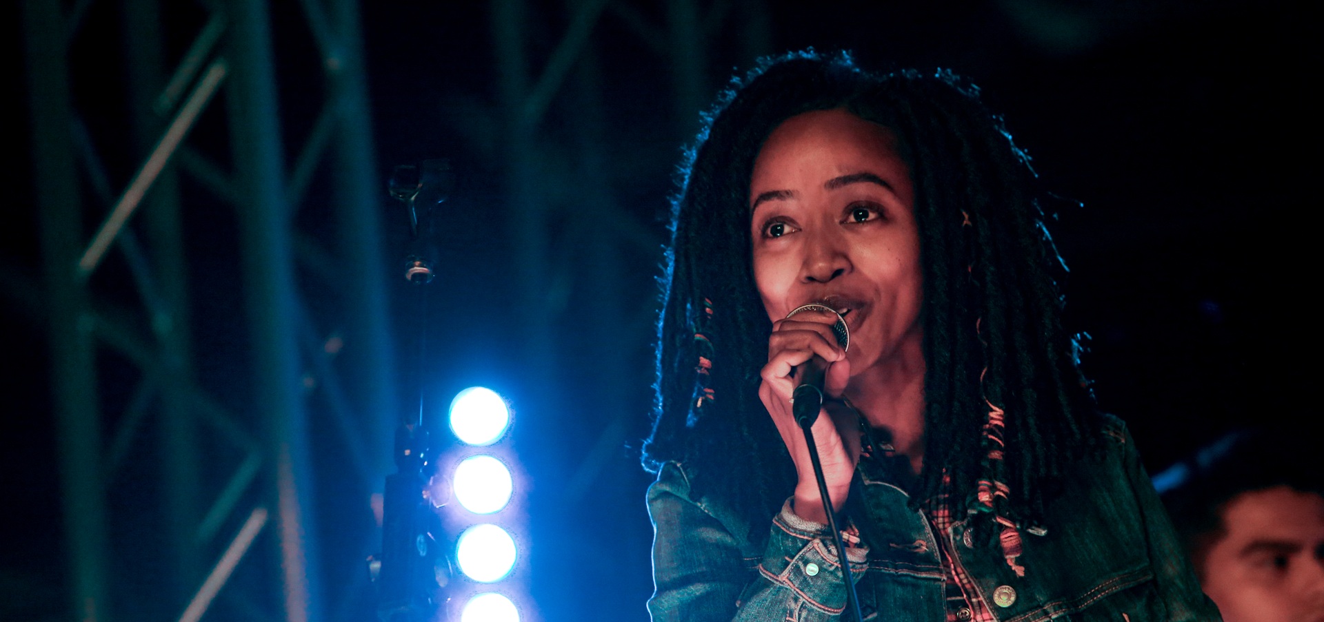 Woman singing on a stage