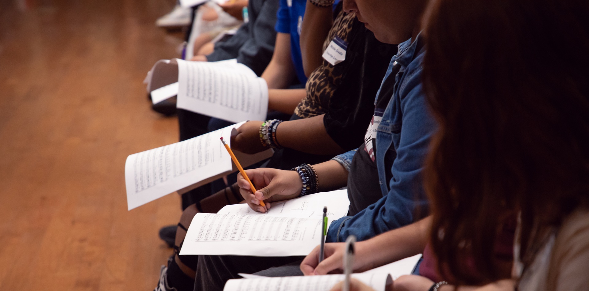 Students in a classroom setting taking notes