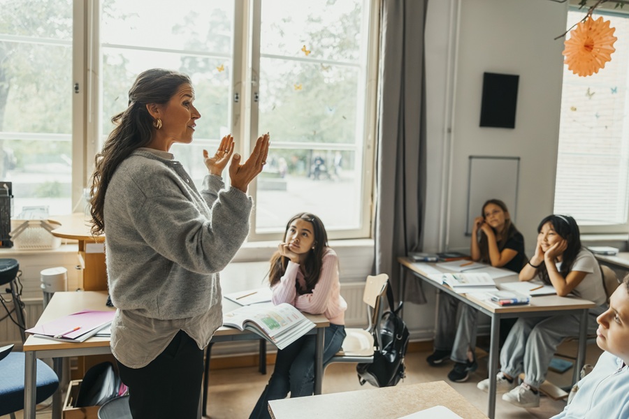 Female teacher teaching a classroom
