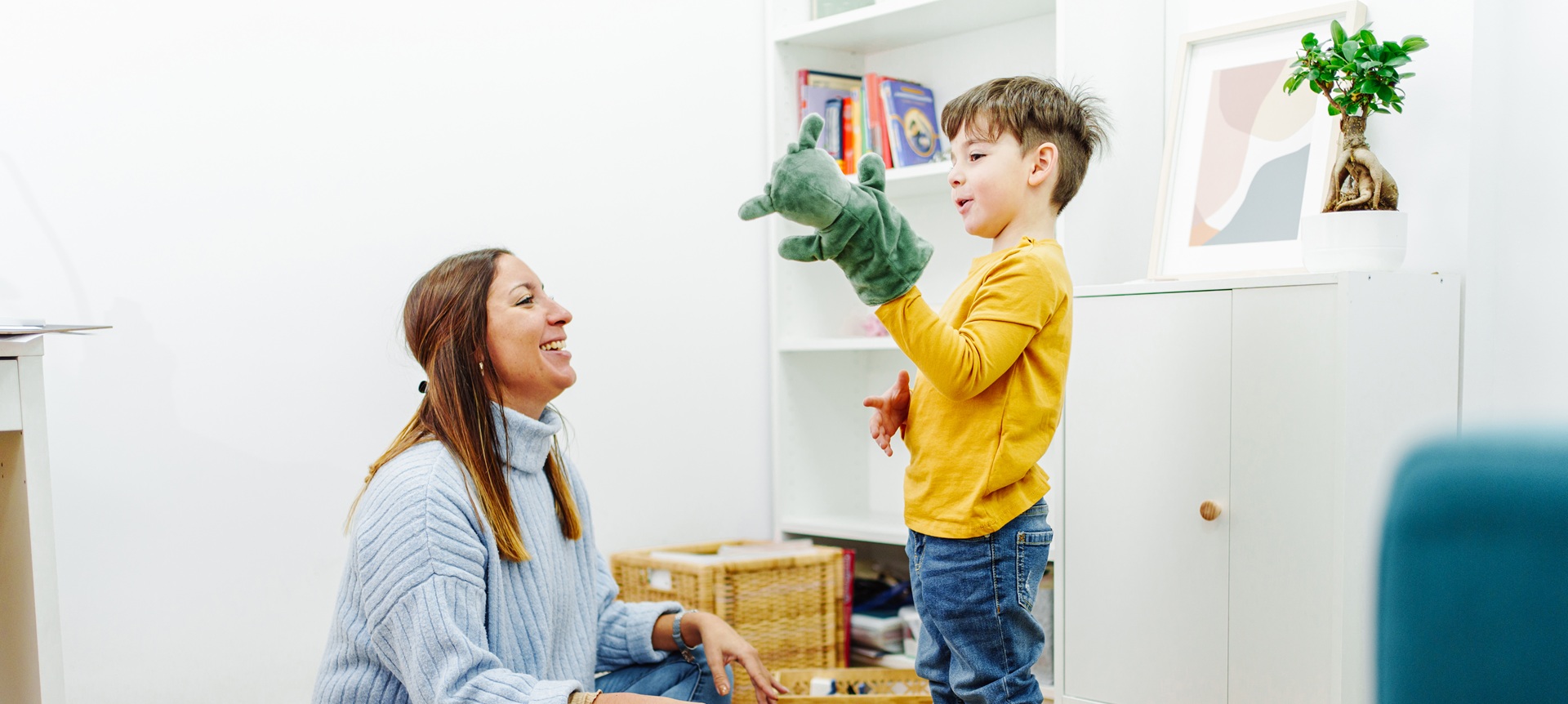 Teacher and student with a puppet