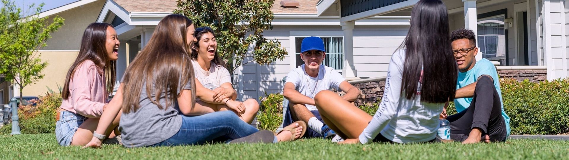 Students gathered in front of the cottages