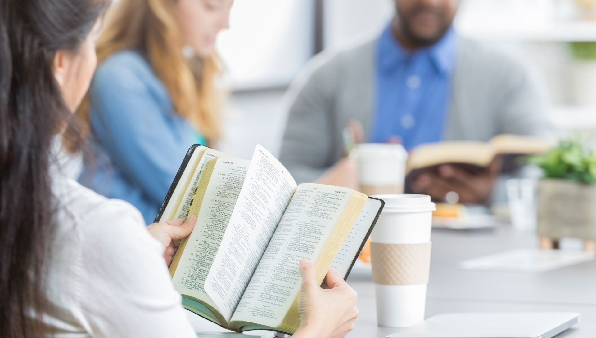 Group reading and discussing the bible