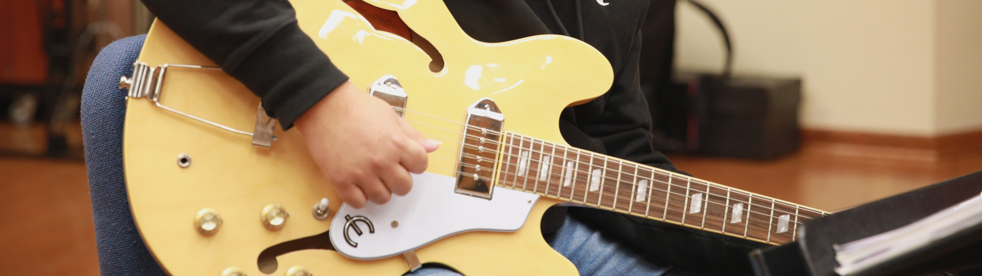 CBU Student playing guitar