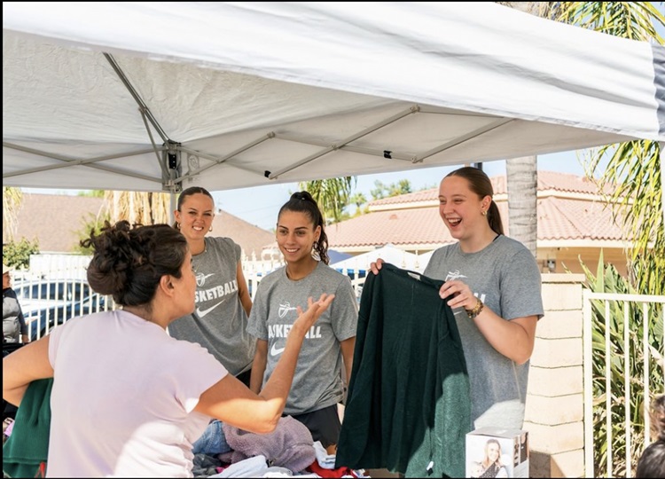 Students handing out T-shirts