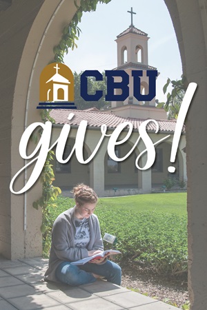 Student outside building with the logo CBU Gives at the top